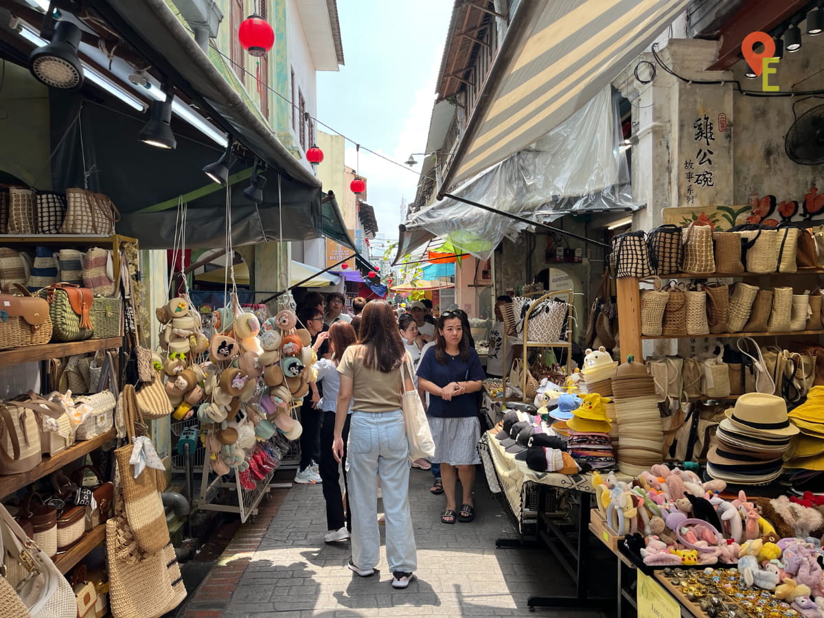 Visitors Browsing Shops At Concubine Lane